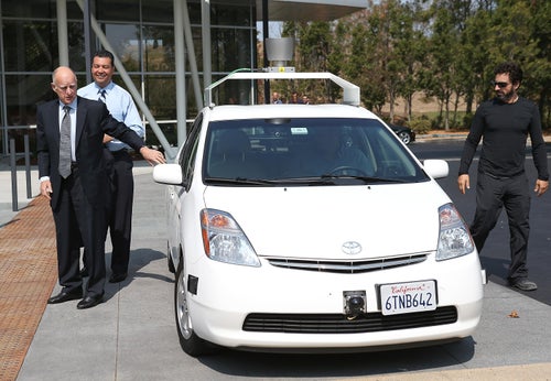 California Gov. Jerry Brown, California State Sen. Alex Padilla, and Google co-founder Sergey Brin exit a self-driving car at the Google headquarters on Sept. 25.